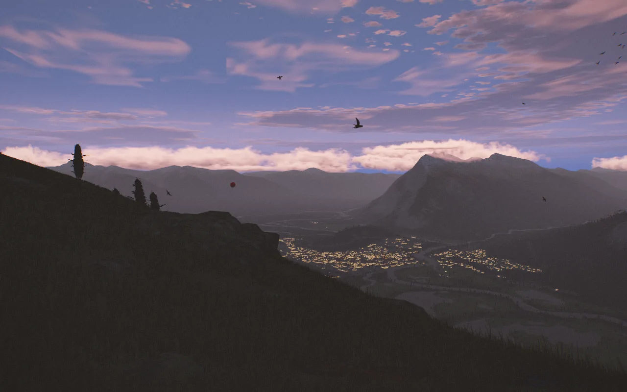Dusk after the release: the meadow in shadow, Banff's lights beginning in the valley and pink cloud over the far ranges